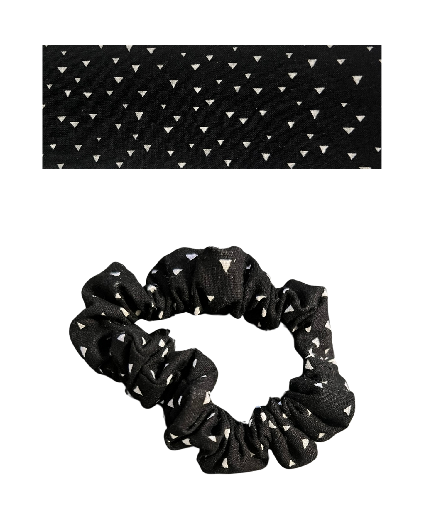 Black scrunchie with white triangle pattern on a white background