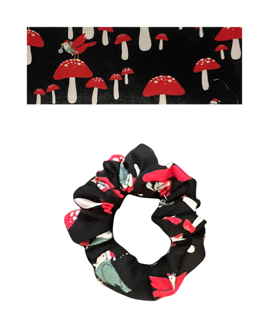 Black fabric with red mushrooms and red birds