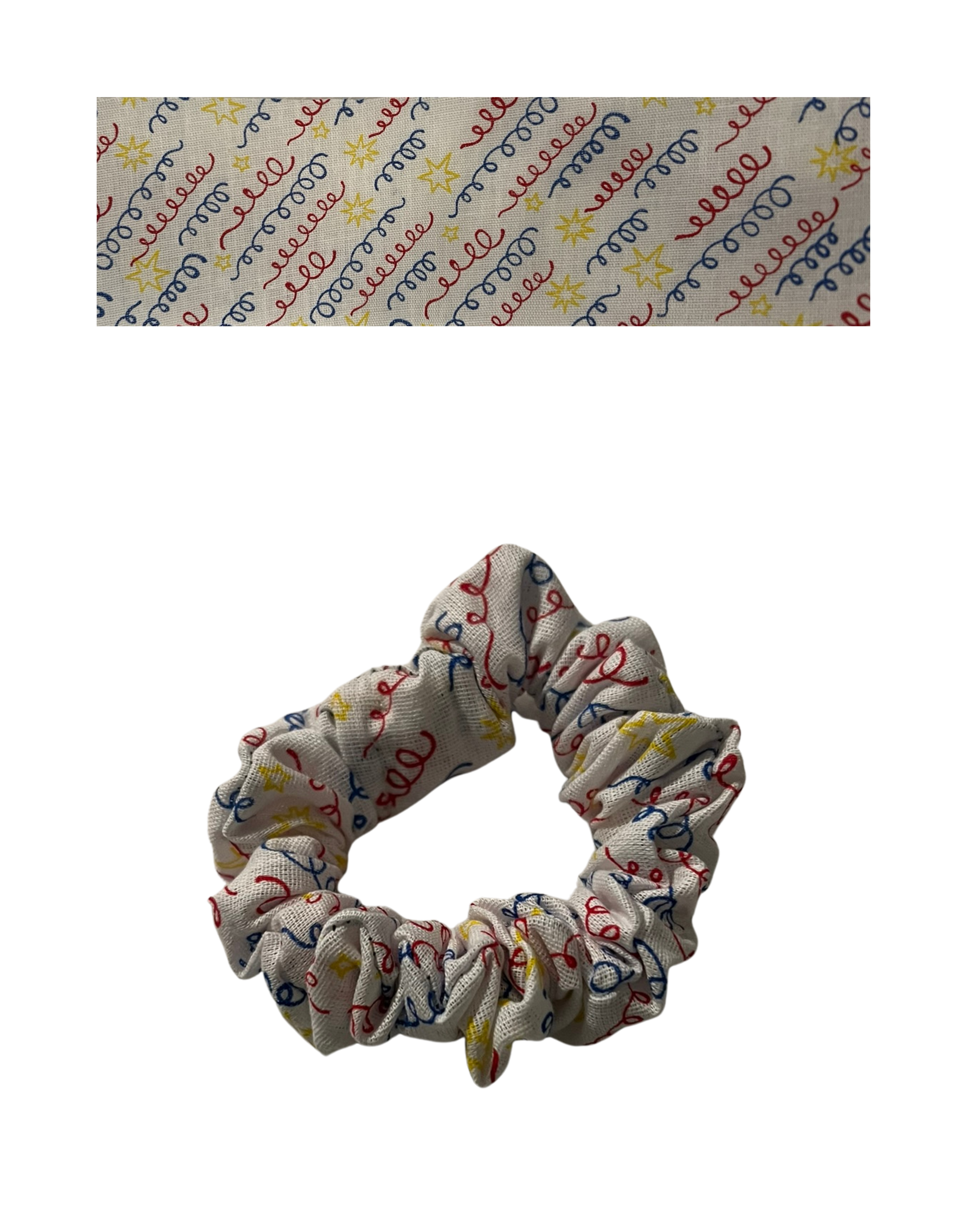 Primary colors party streamers on white fabric