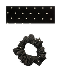 Black scrunchie with white polka dots on a white background
