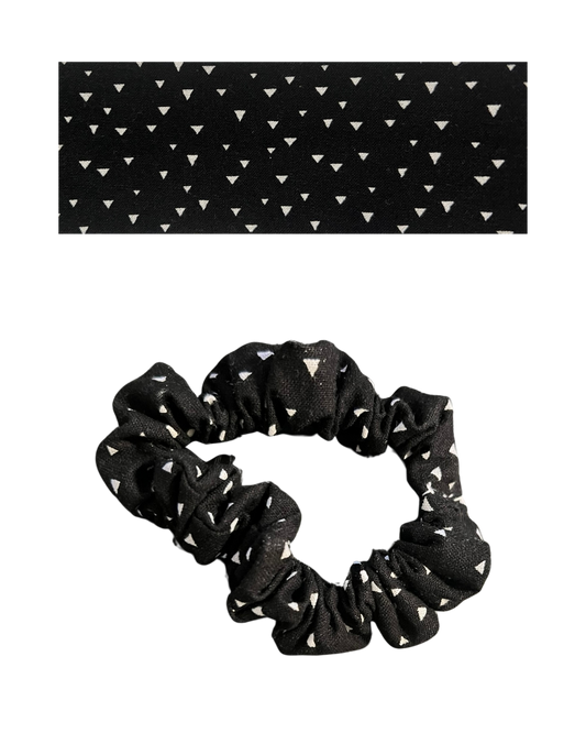 Black scrunchie with white triangle pattern on a white background